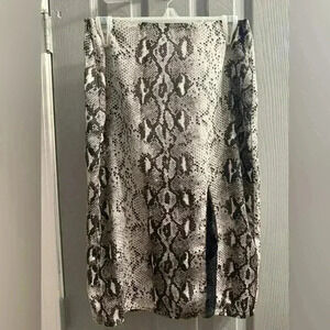 Sen reptile snakeskin print knee length skirt with lace split in front. Small